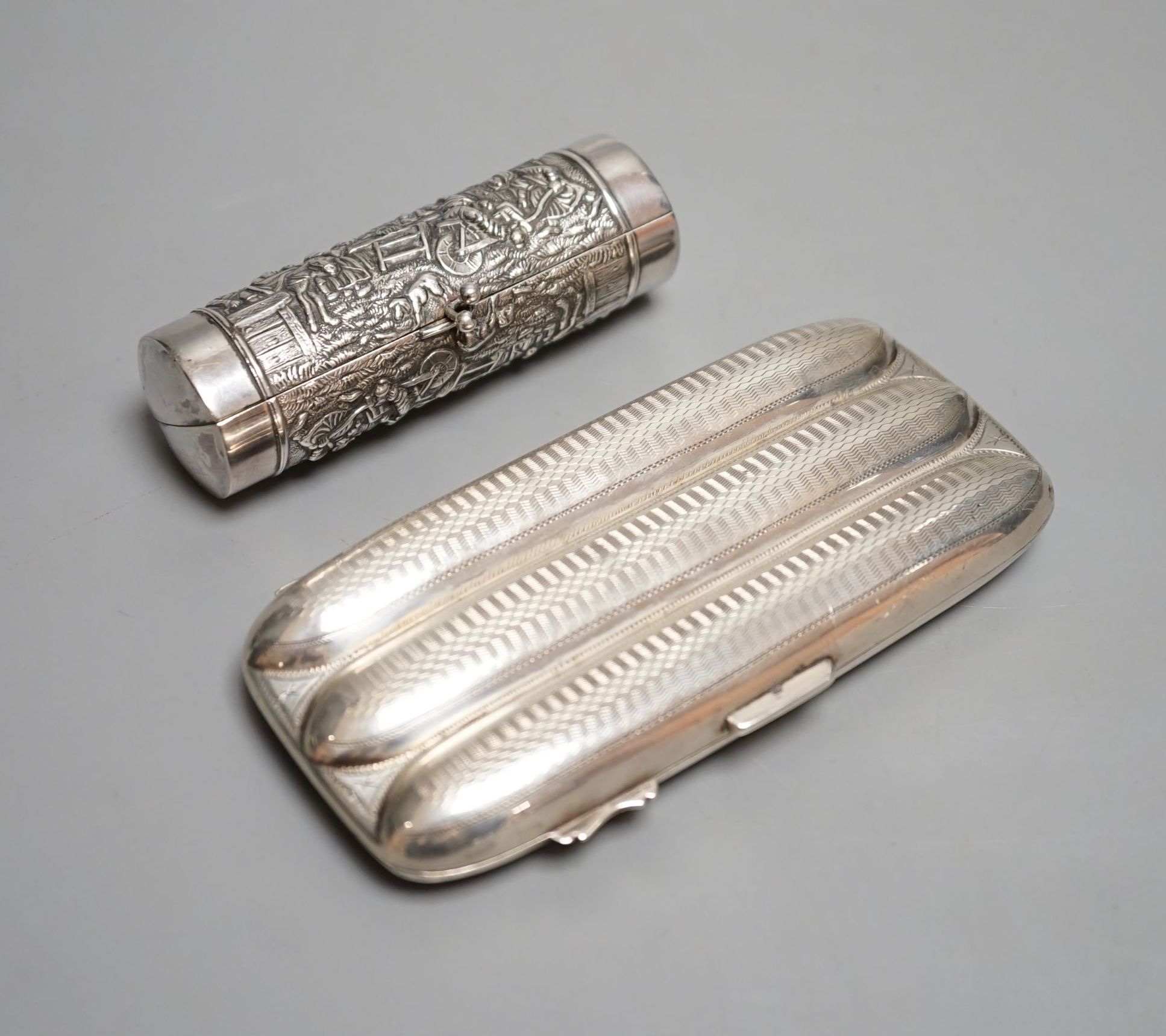 A George V silver three division cigar case, Birmingham, 1915, 13.1cm and a white metal cylindrical purse.